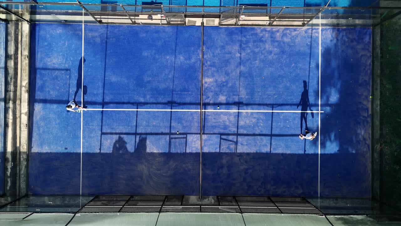 Aerial view of padel tennis court with players