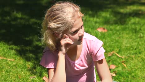 young girl thinking outdoors