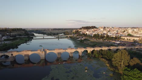 aerial of ancient moorish bridge connecting twin cities