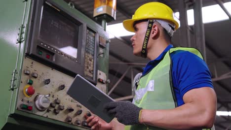 smart factory worker using machine in factory workshop