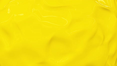 4k luz brillante amarillo soleado líquido fondo abstracto. color limón textura de plástico fresco.