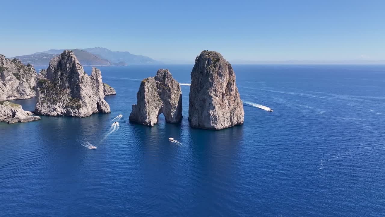 Faraglioni Island At Capri In Naples Italy. Beach Landscape. Giant Cliffs Scene. Faraglioni Island At Capri In Naples Italy. Gulf Of Naples Skyline. Mediterranean Sea Coast. Scenic Capri Island.