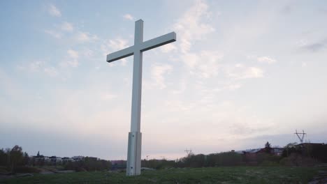 wooden cross against the evening sky