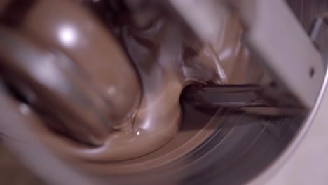 delicious liquid chocolate mixing in conching machine