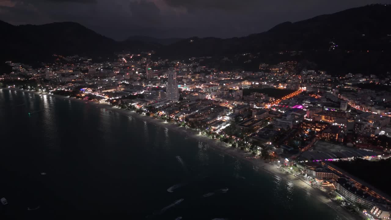 Drone shot of a sunset Patong in Phuket, Thailand at night