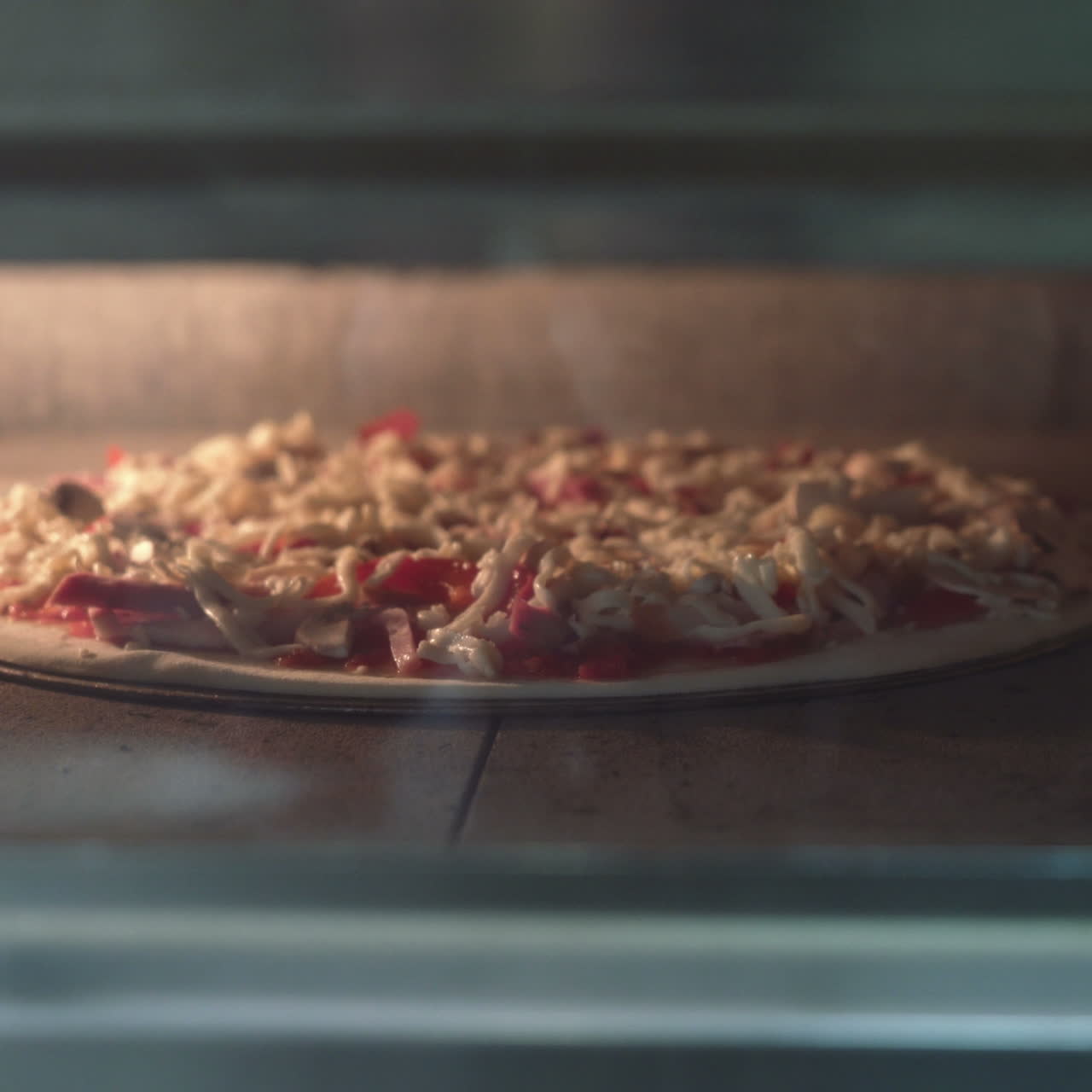 Putting pizza into oven. Italian Pizza in oven Sqare video