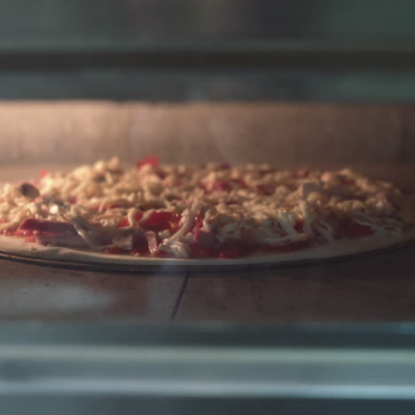 putting pizza into oven. italian pizza in oven sqare video