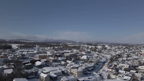 establishing aerial shot snow covered town in suburban japan