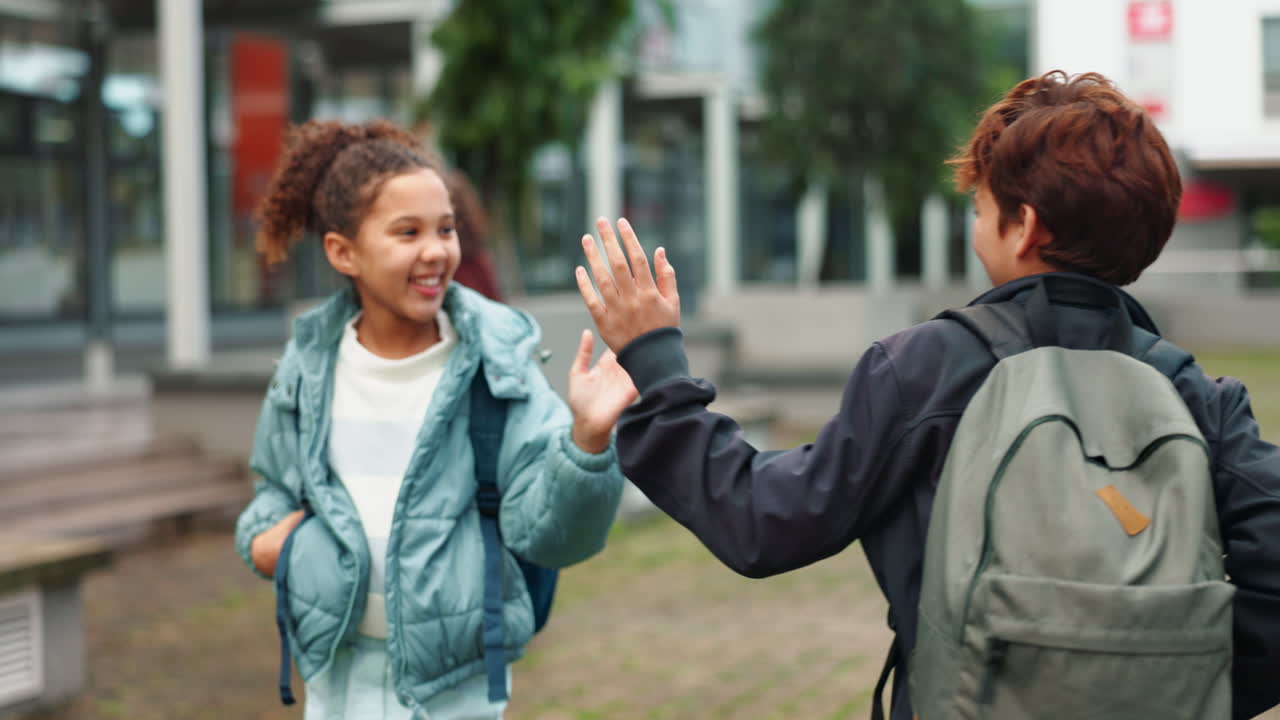 Children greeting each other at school