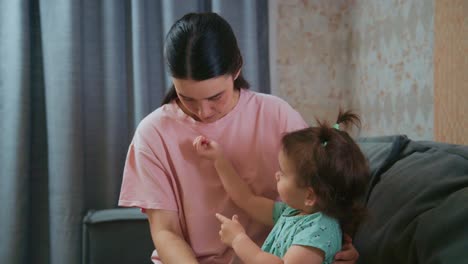 A Loving Moment: A Parent Gently Styles Their Child&#039;s Hair, Creating Cherished Memories and Bonding Through Tender Care at Home
