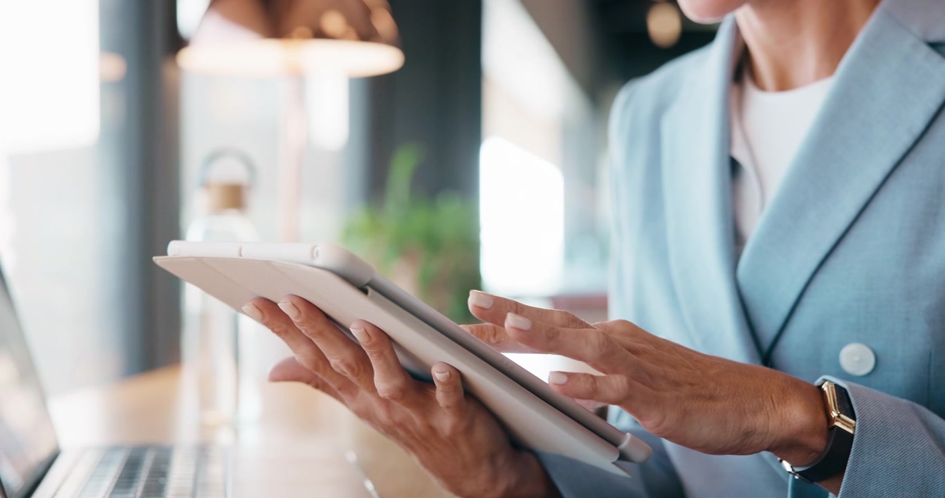Businesswoman Using Digital Tablet in Modern Office