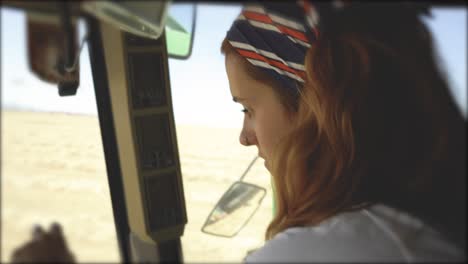 focused woman operating agricultural machine