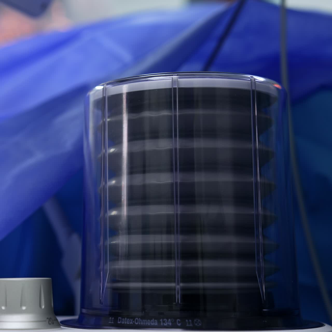 The pump working at lung ventilation machine. Close up. Surgery is in process at backdrop in blur