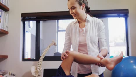 physiotherapist giving physical therapy to the boy 4k