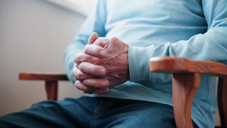 elderly man sitting in a chair