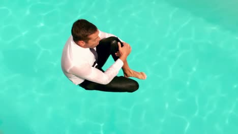 businessman jumping in the swimming pool