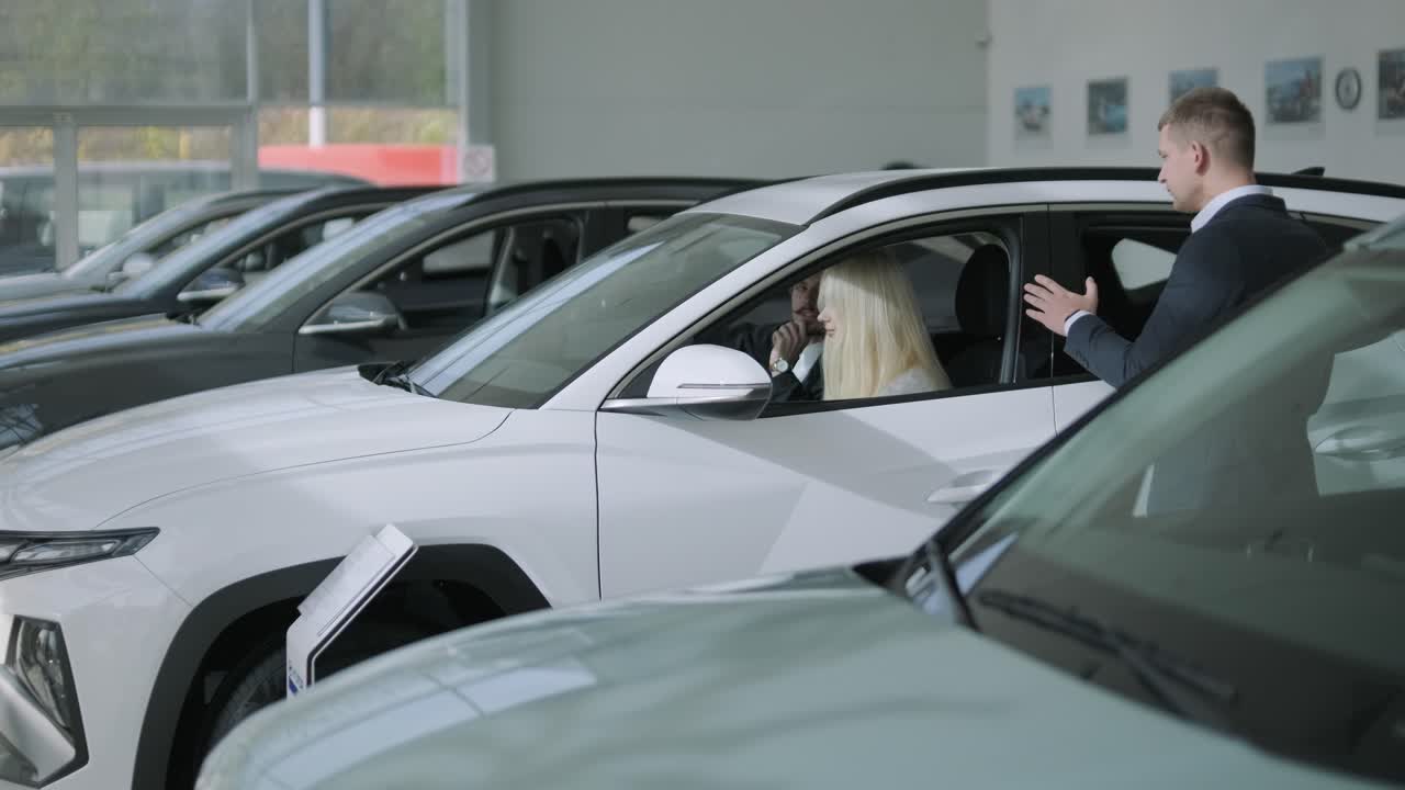 Car dealership with customers and salesman