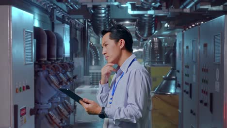 factory engineer working on digital tablet