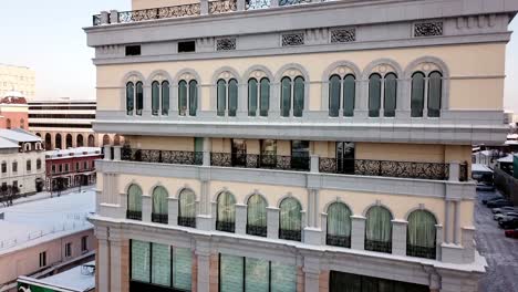 elegant building facade with balconies in winter