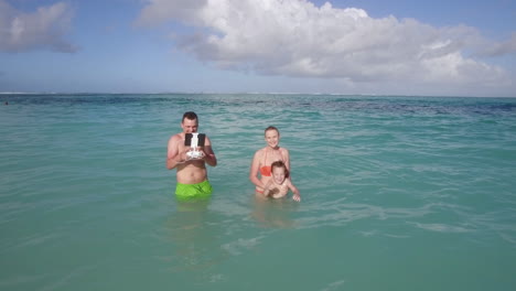 family bathing and aerial view of ocean