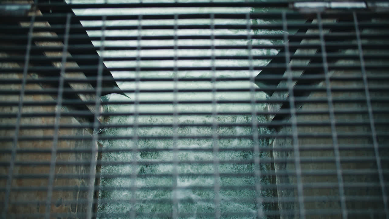 Rushing Dam Flood Water in Underground Drainage Overflow Tunnel through Metal Grate