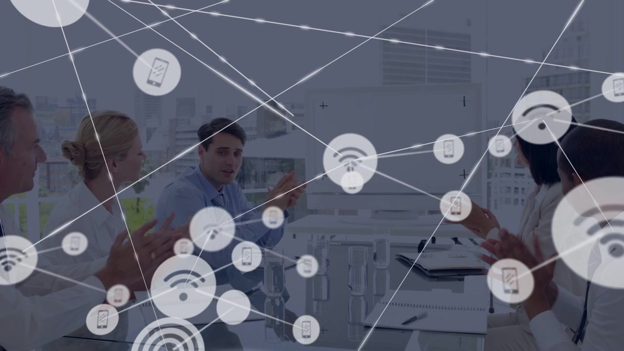 Team of five clapping at table as icon appearing, sending nodes, covering team showing tech network