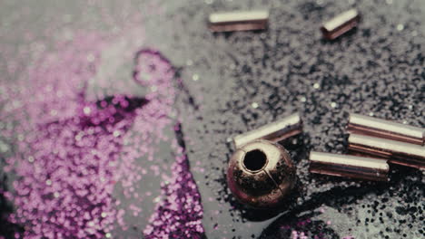 close-up of glitter, beads, and metal components