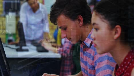 Animation-of-financial-data-processing-over-caucasian-boy-while-using-laptop-and-smiling-at-school