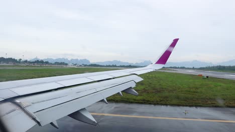 airplane wing view from window during taxiing