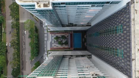 high-rise apartment complex with rooftop pool