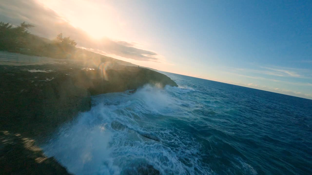Dramatic Ocean Waves Crashing on a Cliff at Sunset