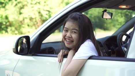 vacation time and travel, three beautiful young women cheerful travels together for a relaxing holiday. and the laughter in the car. finding directions by map.