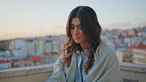 organized lady planning week on sunset rooftop place with cityscape closeup