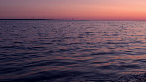 Wind-turbines-on-cape-at-sunset