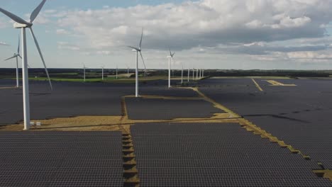 scenery of wind farm turbines and solar cell plant on rural landscape near holstebro, denmark