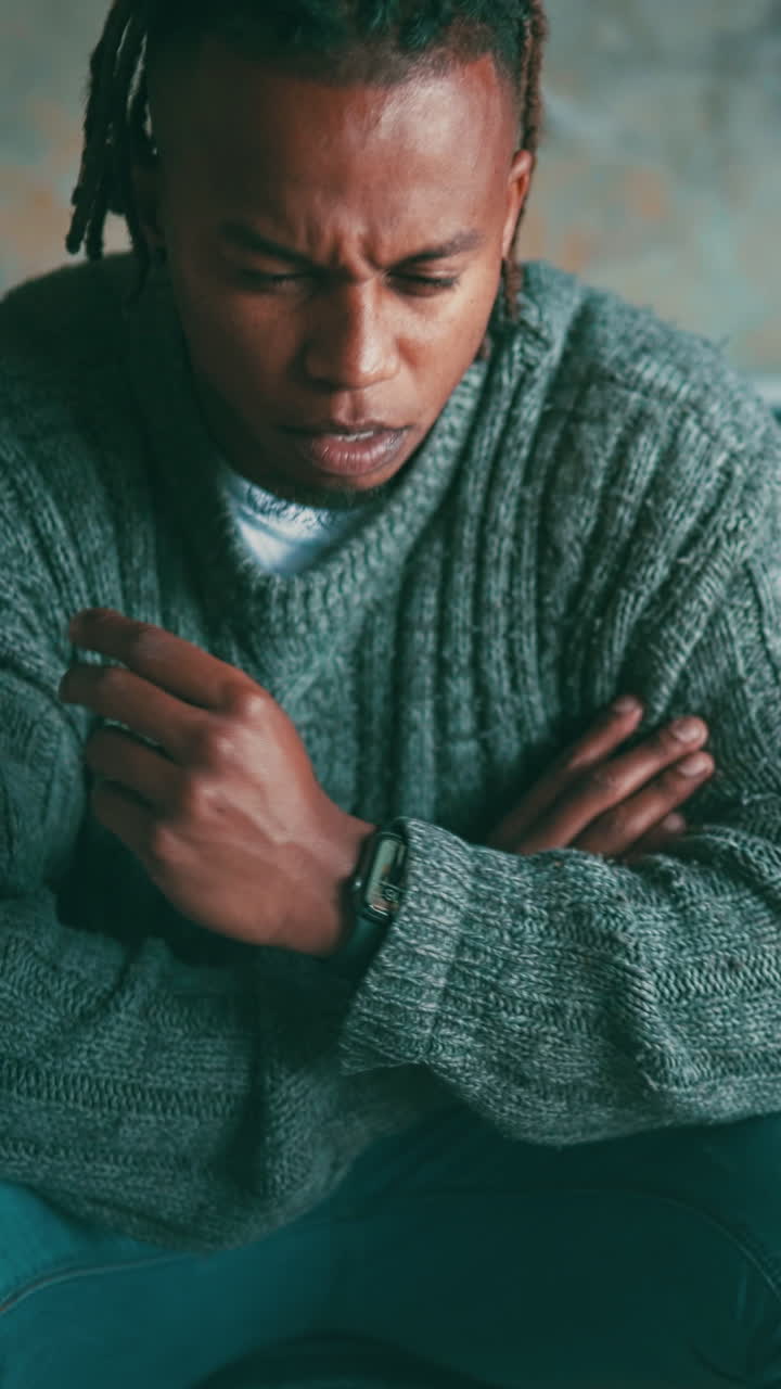 Young Black Man Laughing After a Thoughtful Moment