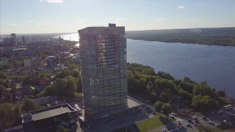 aerial view of a city with a skyscraper and river