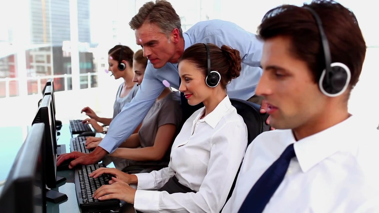 Animation of abstract pattern over caucasian manager assisting call center agent working on computer