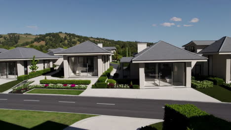 modern residential complex with landscaped gardens and hillside views
