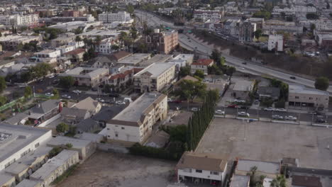 4K-Cinematic-flight-over-East-Hollywood-near-downtown-Los-Angeles-with-the-101-freeway-in-the-background