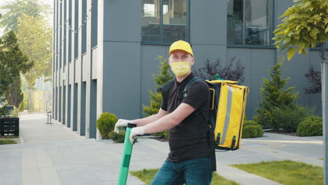 delivery person on scooter, wearing a mask