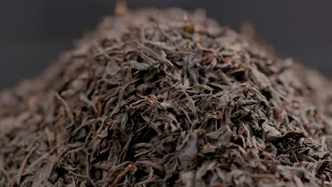 looped spinning dry black tea full frame close-up background