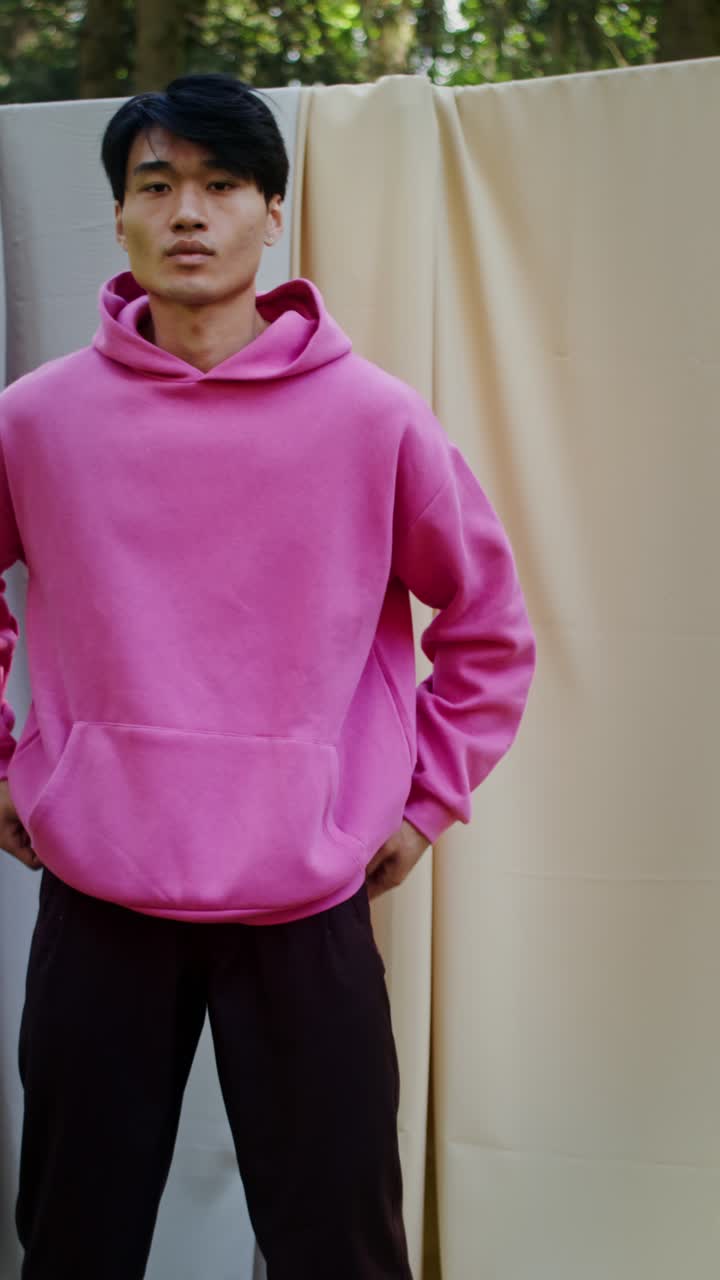 Man in a pink hoodie
