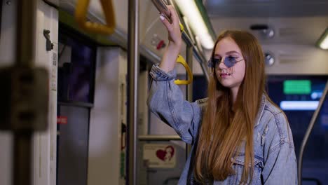 tired, depressed stylish young woman stay alone in bus transport after hard work day, falls asleep