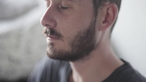 Eyes-close-up-of-a-man-while-meditating-in-the-early-morning