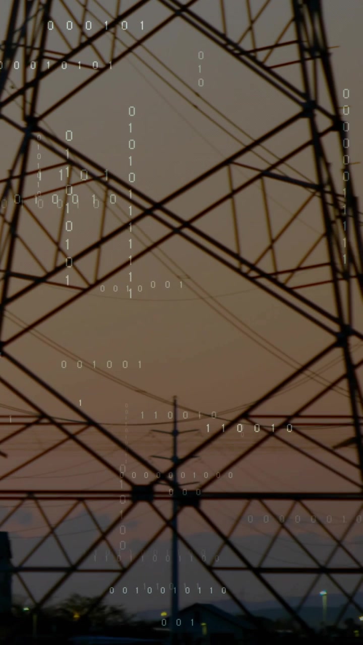 Vertical video: Camera panning right starting towers rising, wires crossing showing grid with bits