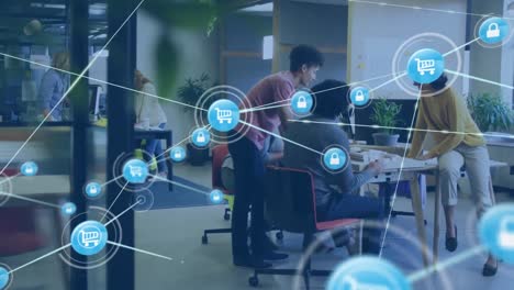animation of connected shopping cart and padlock icons over diverse colleagues talking in office