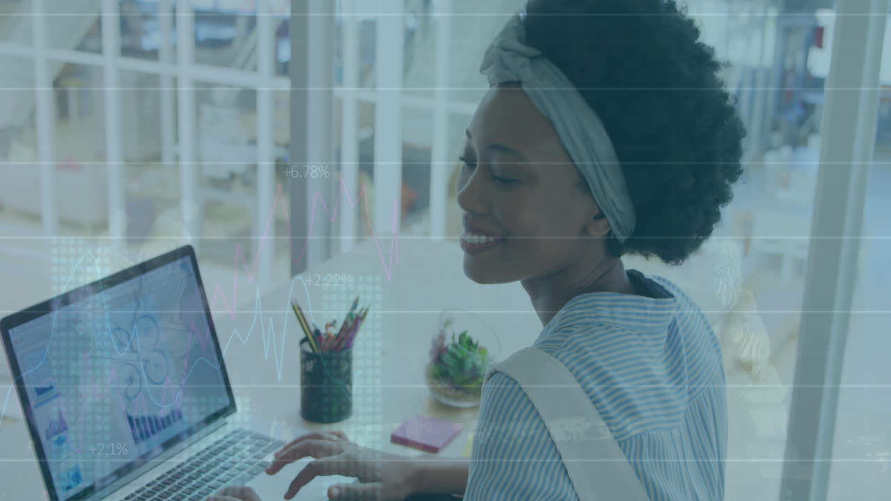 Animation of financial data processing over biracial businesswoman in office