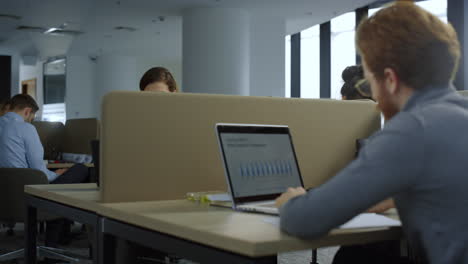 Excited-businesswoman-reading-good-news-on-smartphone-screen-at-workplace