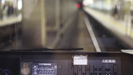 view from front car of subway moving in tunnel